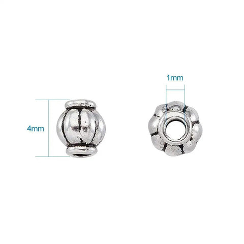 Antique Silver Tibetan Style Pumpkin Spacer Beads 4mm, 100 Piece Set for DIY Jewelry Making, close-up showing 4mm diameter and 1mm hole