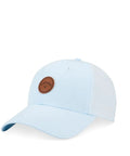 Light blue baseball cap with brown circular patch on the front, minimalist design.