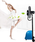 Badass Heavy Duty Mist Fan With Solid Metal Build Rock Solid Cooling Power to Block Heat Featuring Adjustable 3 Speeds and Humidifying Spray for Your Shop Patio or Outdoor Hangout next to a dancer.