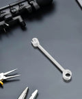 Adjustable Hinge Gap Tool Heavy Duty Wrench For Precision Door Hinge Alignment And Repair Fits Fireproof Doors And Multiple Hinge Types Portable DIY Friendly Tool For Home And Commercial Use on black surface surrounded by tools.