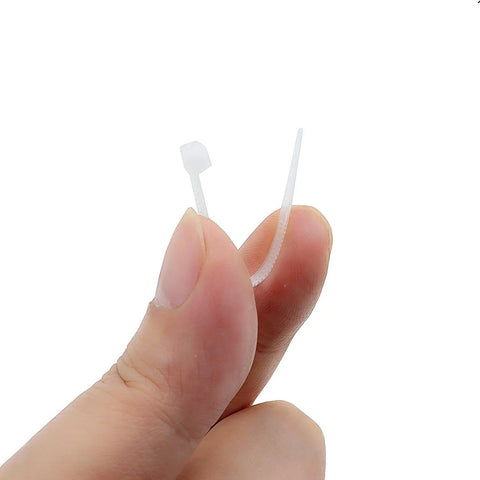 Close-up of 100 Pcs Self Locking Nylon Cable Ties 60mm Long, 2.5mm Wide, 18 Lbs Tensile Strength, Ultra Thin Mini Zip Tie