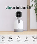 Smooth Swiveling Indoor Security Camera Locks Down Your Space With Crisp HD Video And Infrared Night Vision For Seamless Pan Tilt Coverage Plus Quick Plug And Play Two Way Audio Alexa Ready White displayed on a shelf with plant.