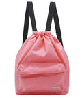 Pink Dry Wet Separated Swim Bag With Drawstring Backpack, Waterproof Gym Pool Beach Gear Tote For Adults and Kids, front view.