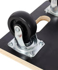Close-up of the smooth swivel caster on a heavy duty furniture dolly, showing the sturdy plywood platform.