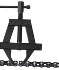 Heavy Duty Motorcycle Chain Tensioner Tool That Makes Bike Wrenching A Breeze Straight Up Solid Steel Chain Adjuster Kit close-up on steel tool against chain links.