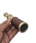6 Inch Brass Pirates Telescope Collapsible Handheld Monocular Go-To Travel And Adventure, Outdoor Exploration, Ideal Gift For Navy Enthusiasts, Bird Watching, Trekking, And Collectible Nautical Spyglass in hand