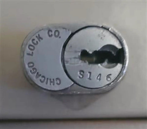 Heavy Duty Office Cabinet Replacement Key For S110 Core Fits Desk Drawers And Modular Cubicle Locks Genuine Oem Brass Hardware No Fuss Setup Slides Like A Charm For Daily Grind Use - Close-up of CompX Chicago lock with S146 engraving.