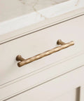 Champagne Bronze Cabinet Pulls 5 Inch Hole Center 10 Pack No Brainer Durable Hammered Sleek Handles installed on cabinet drawer
