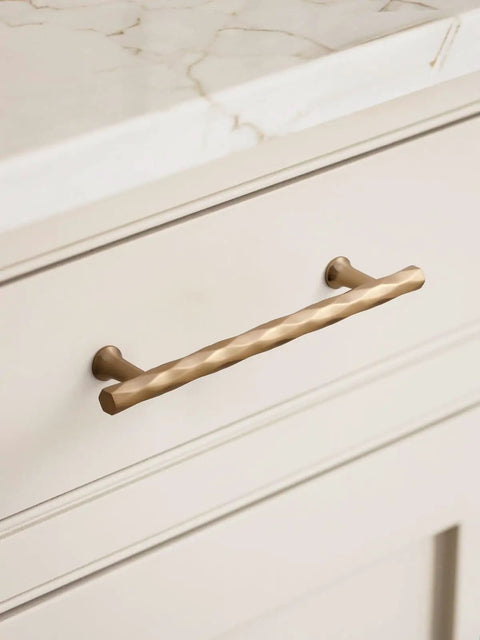 Champagne Bronze Cabinet Pulls 5 Inch Hole Center 10 Pack No Brainer Durable Hammered Sleek Handles installed on cabinet drawer