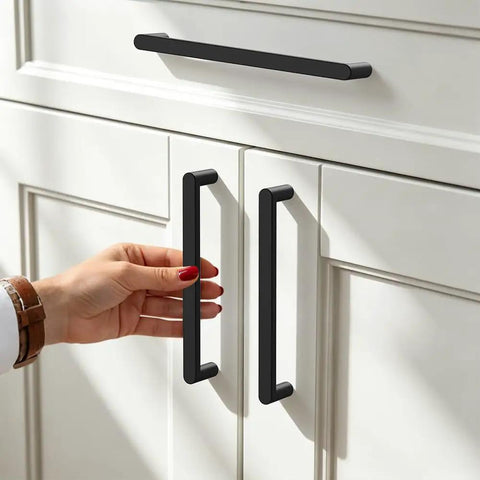 Person using 5 Pack 160mm Edge Black Hidden Drawer Cabinet Handle Aluminum Alloy Finger Edge Pull Concealed Back Mount Dresser Hardware For Kitchen And Bathroom, Rust Resistant, Waterproof, Smooth Sliding, Easy Install on white cabinets.