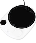 This Solid Electric Mug Warmer Boasts Four Heat Presets To Keep Your Daily Brew Piping Hot All Day Long Featuring Smart Auto Shut Off Protection And Fast Heating With A Sleek White Top For Desk Setup, close-up view of white electric mug warmer.