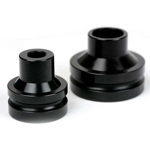 Close-up of two dies from 6-Piece Dimple Die Set Tool Kit For Conduit Knockouts Pro Grade Heavy Duty Electrical And HVAC Use. 