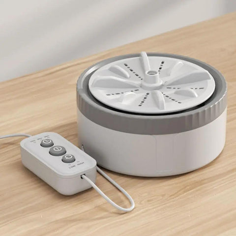 No Sweat Portable Mini Turbo Washing Machine With Steady Grip Base For Daily Baby Laundry And Underwear Lightweight Micro Usb Rechargeable Compact Countertop Cleaner on wooden surface.