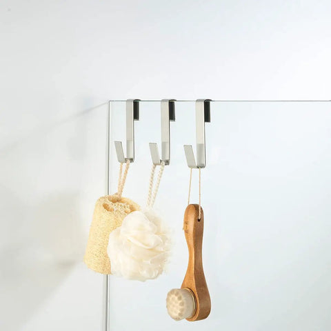 Over Glass Door Towel Hook For Bathroom Frameless Shower Door Fits 3/8 Inch Glass 10 mm Stainless Steel Brushed Finish 3 Pack No Drill Install No Adhesive Needed shown holding bath items.