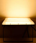 Killer Brightness 300W LED Work Lights Outdoor Flood Light Fixture IP66 Waterproof on a stand illuminating warm white light.