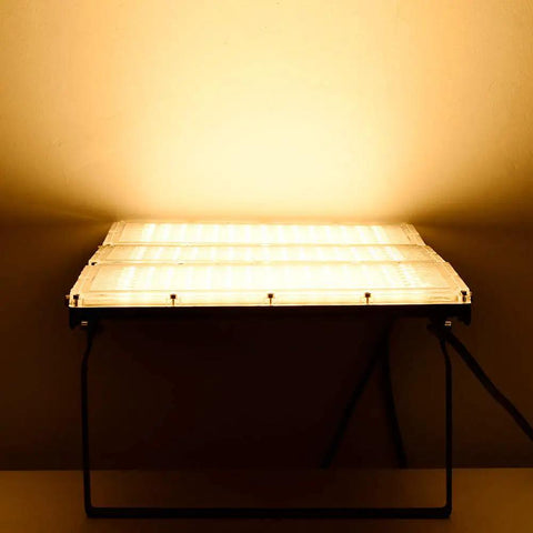 Killer Brightness 300W LED Work Lights Outdoor Flood Light Fixture IP66 Waterproof on a stand illuminating warm white light.