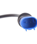Brake pad wear sensor connector, blue plastic housing with black wire, close-up view