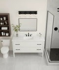 Three Light Matte Black Vanity Light Fixtures For Over Mirror In Bathroom shown above white vanity in modern bathroom setting.