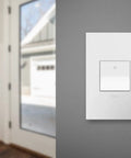 Upgrade Your Home Lighting With A 15 Amp 1 Or 3 Way Paddle Switch And Matching White Wall Plate 4 Pack, installed on wall.