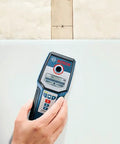 Wall Scanner For Studs Metal And Live Wiring With Center Finder Multi Mode Detection held against wall showing status ring