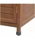 Corner view of massive outdoor storage cabinet crafted from top shelf natural cedar for yard gear and hand tools weather resistant structure.