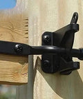 Tough As Nails Self Locking Gate Latch Automatic Fence Lever Heavy Duty Steel Rock Solid Yard Security No Sweat Setup For Inward Outward Swinging Wood Or Metal Gates Black mounted on a wooden gate.