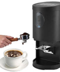 Premium 58Mm Electric Espresso Tamper Featuring Sturdy Adjustable Aluminum Base Hella Smooth Coffee Tamping Tool For Quick Barista Shots In Sleek Black with coffee cup and portafilter.