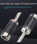 Top Shelf Banana Plugs Quad Pack With Secure Screw Lock Mechanism And Smooth Carbon Fiber Shell For Crisp Signal Transfer Heavy Brass Terminals Provide Strong EMI Shielding For Up To Forty Five Millimeter Speaker Hookup, close-up view of carbon fiber tooth insert.