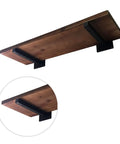 Tough As Nails Dual Pack Wall Mounted Floating Shelf Brackets In Industrial Black with wooden shelf and black supports.