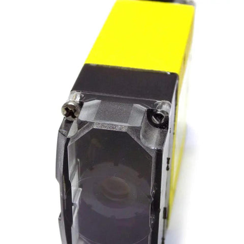 Close-up of Industrial Barcode Reader With Cable 5 To 24V DC Power 2.5W DM-100X Scanner Controller for inventory tracking.