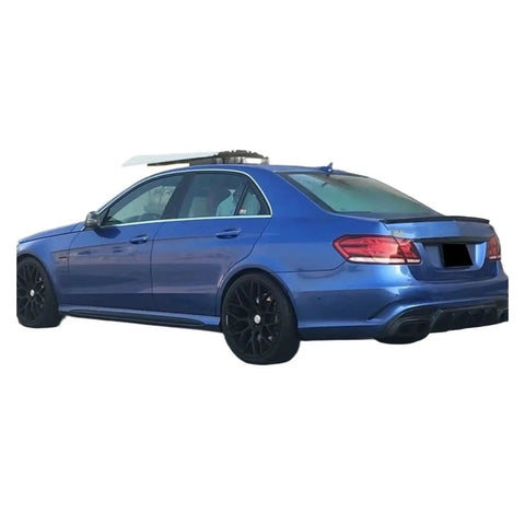 Mercedes W212 E63 E63S with Carbon Fiber Rear Diffuser Lip, featuring no-drill direct fit and precise 3D modeling for body lines.