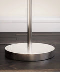 Base of Ultra Tall Industrial Tree Floor Lamp With Three Adjustable Spotlights In Brushed Steel Finish on wooden floor