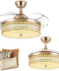 42 Inch Gold Crystal Ceiling Fan With Retractable Blades And Warm Light No Sweat Remote Control Straight Up Chandelier view with pillows.