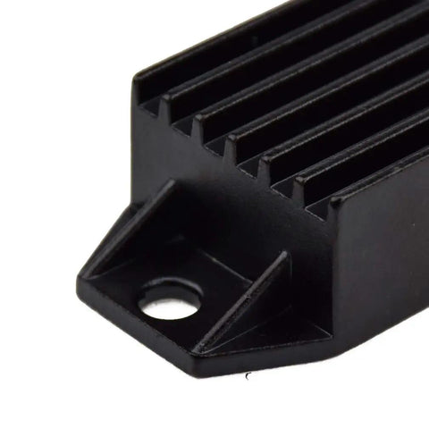Close-up of Voltage Regulator Rectifier 4 Pin Replacement for Tao Tao ATA 110 ATV with black heat sink and mounting hole.