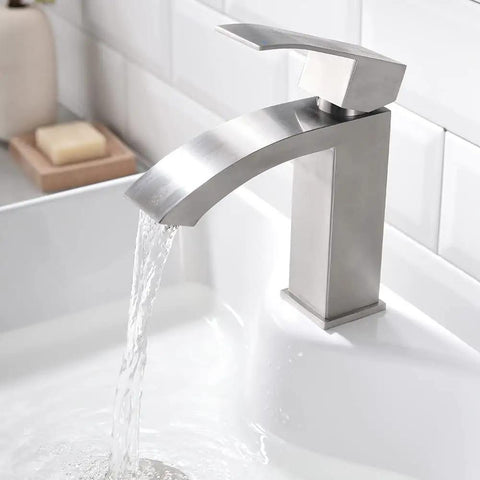 White Rectangle Ceramic Bathroom Vessel Sink And Brushed Nickel Waterfall Faucet Combo in use with water flowing