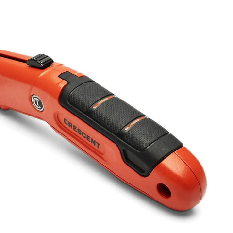 Close-up of Auto Retracting Safety Utility Knife with Quick Change Blades, Thumb Bridge Grip, highlighting the handle design.