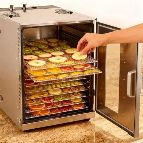 Heavy Duty Stainless Steel Electric Food Dehydrator Pulls A Hefty Multi Tray Load For Drying Fresh Fruits And Veggies with sliced fruits in trays.