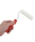 4 Inch Mini Paint Roller Kit With Tray For Gloss And Satin Finishes Straight Up Dead Simple Setup And Smoother Wall Corner Coverage No Sweat High Performance DIY Touchup Gear For Small Rooms in hand.