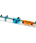 Router Table Fence System Kit With Aluminum Fence Thirty Two Inches Long And Three And A Half Inches Tall Easy Adjustment Knob Flip Stop Measuring Tape Feather Board Bit Guard Built In Dust Port shown with feather board and dust port.