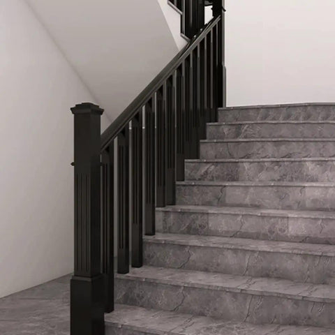 Rock Solid Black Poplar Wood Balusters And Stair Spindles For Deck Railing System 38 Inch installed on stair railing with gray steps.
