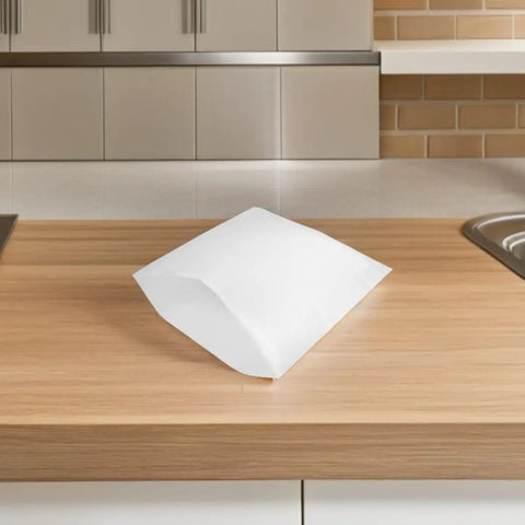 White EPE Foam Pouches Set Of 25 For Shipping Fragile Items And Glassware on a wooden countertop