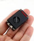 Hand holding Beefy Two Point Five Watt FPV Transmitter Five Point Eight GHz Long Range For RC Drones With CNC Shell Lock On Tech