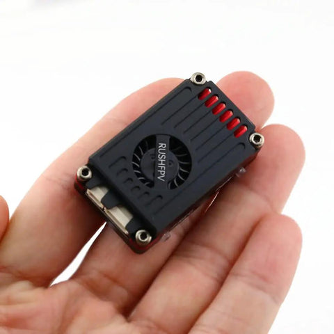 Hand holding Beefy Two Point Five Watt FPV Transmitter Five Point Eight GHz Long Range For RC Drones With CNC Shell Lock On Tech