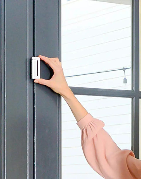 Woman installing a Door Guardian Lock And Reinforcement Kit For Inward Swing Doors Child Safety Lock For Doors 2 Pack White