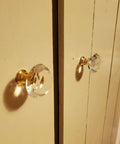 8 Pack Crystal Glass Cabinet Knobs with Gold Base installed on wooden cabinet doors