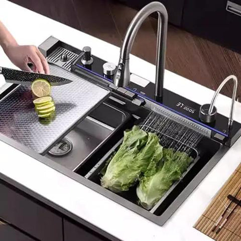 Multifunctional Stainless Steel Waterfall Faucet for Large Single Bowl Sinks - Honeycomb Pattern Design, Easy Installation and Durable Performance in use with vegetables.