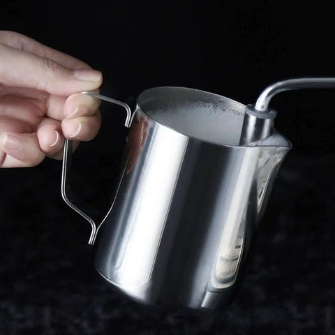 Hand holding a sleek silver milk frother, perfect for the Compact Semi Automatic Coffee Maker Featuring 5 Bar Pressure Pump For Creamy Lattes And Bold Espressos Silver Steam Frother Making Countertop Barista Sessions Totally Effortless.