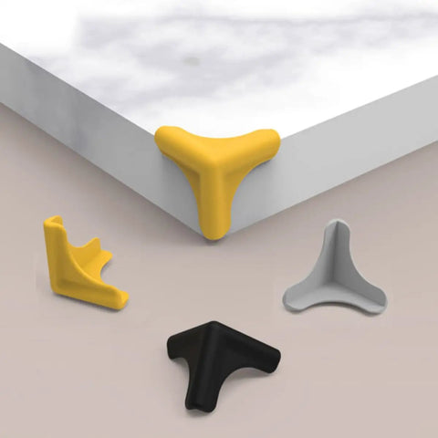 4 Pack Silicone Corner Guards For Furniture And Cabinets Baby Edge Protectors in different colors on table corner