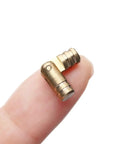 Mini Folded Box Concealed Barrel Hinge Set In Pure Copper For Furniture on fingertip.