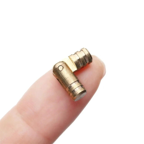 Mini Folded Box Concealed Barrel Hinge Set In Pure Copper For Furniture on fingertip.